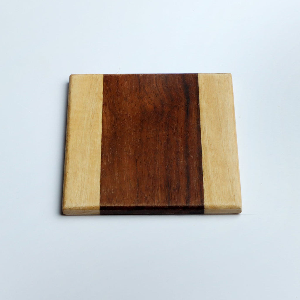 Set of four handcrafted wooden coasters in a square design, made from solid wood. Perfect for protecting surfaces from cups, glasses, and candles. A rustic and elegant addition to any home décor or as a thoughtful gift for special occasions
