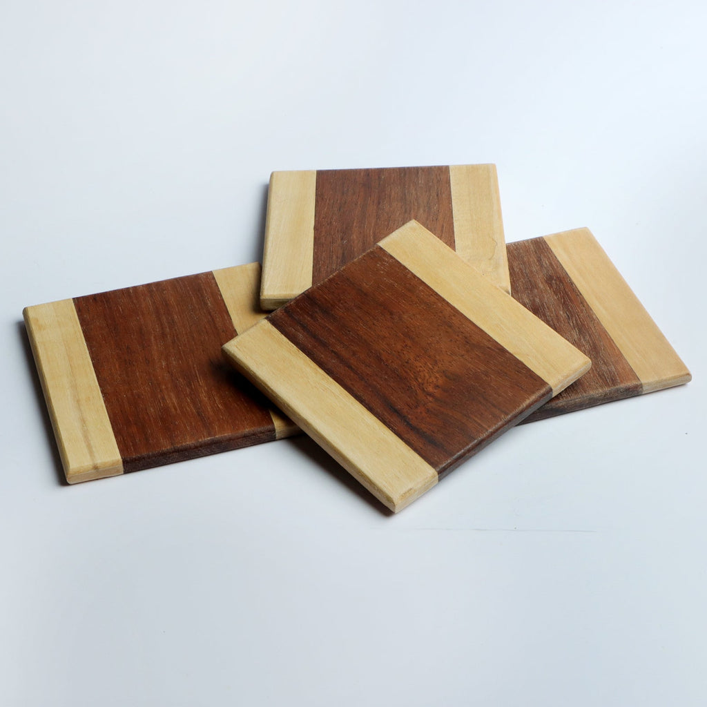 Set of four handcrafted wooden coasters in a square design, made from solid wood. Perfect for protecting surfaces from cups, glasses, and candles. A rustic and elegant addition to any home décor or as a thoughtful gift for special occasions
